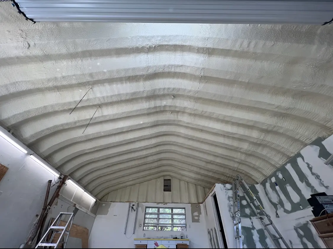 Spray polyurethane foam applied to the underside of a metal roof deck in Bel Air